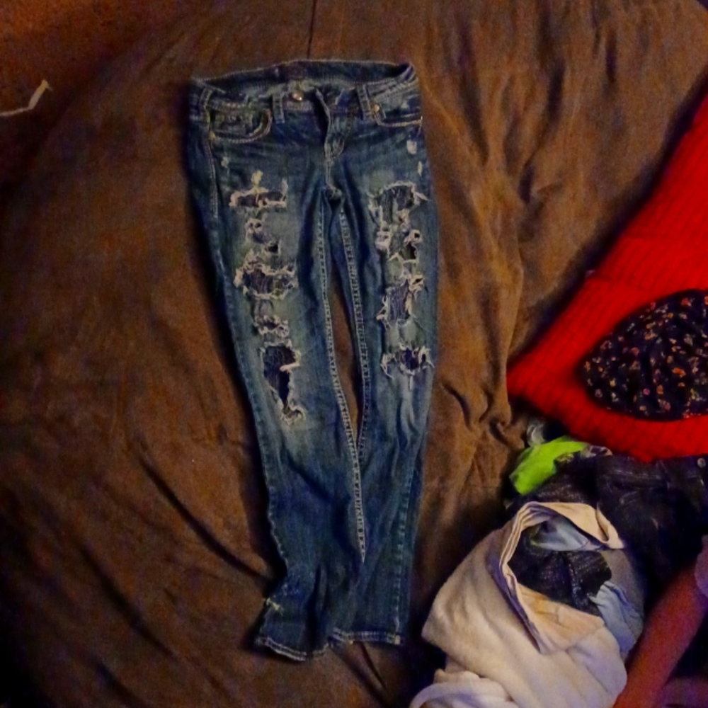 Ripped silver jeans